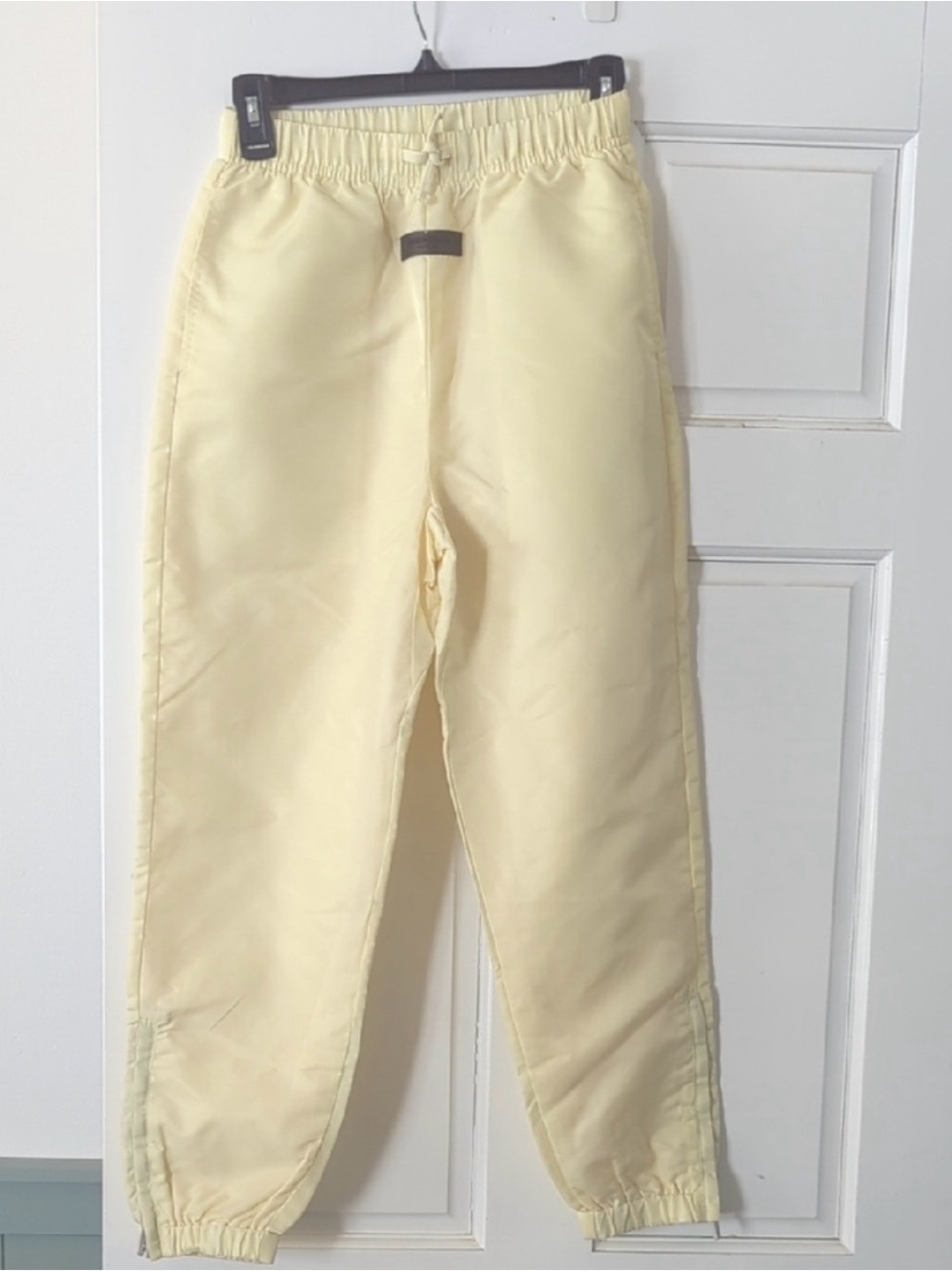 Fear of God Essentials canary track Pants (new) size kids 10